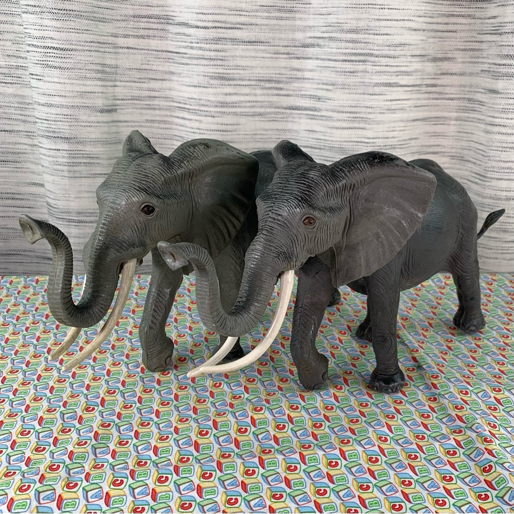 A Pair of Majestic Elephant Action Figures.